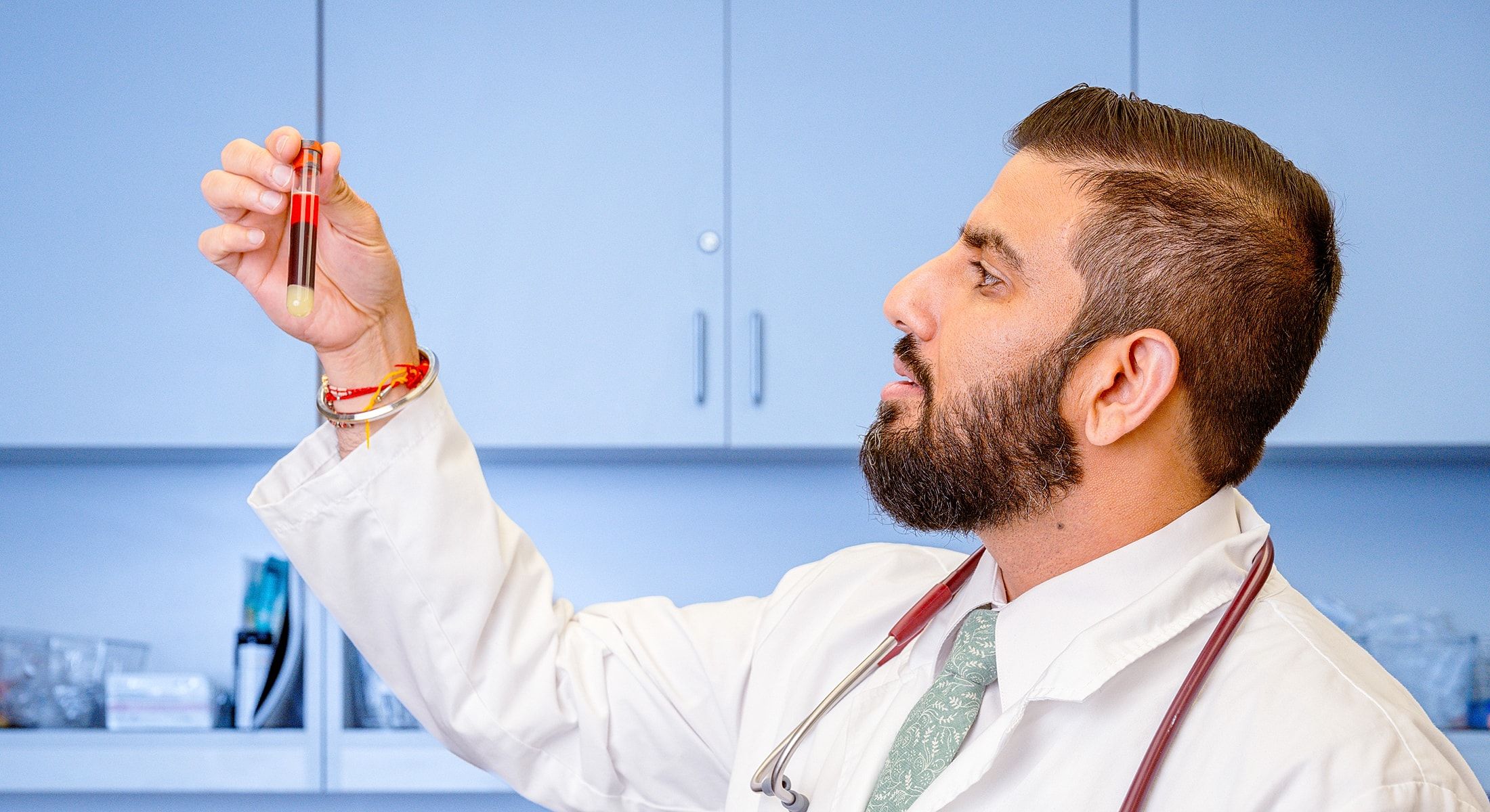An Avita MD physician reviewing detailed lab work