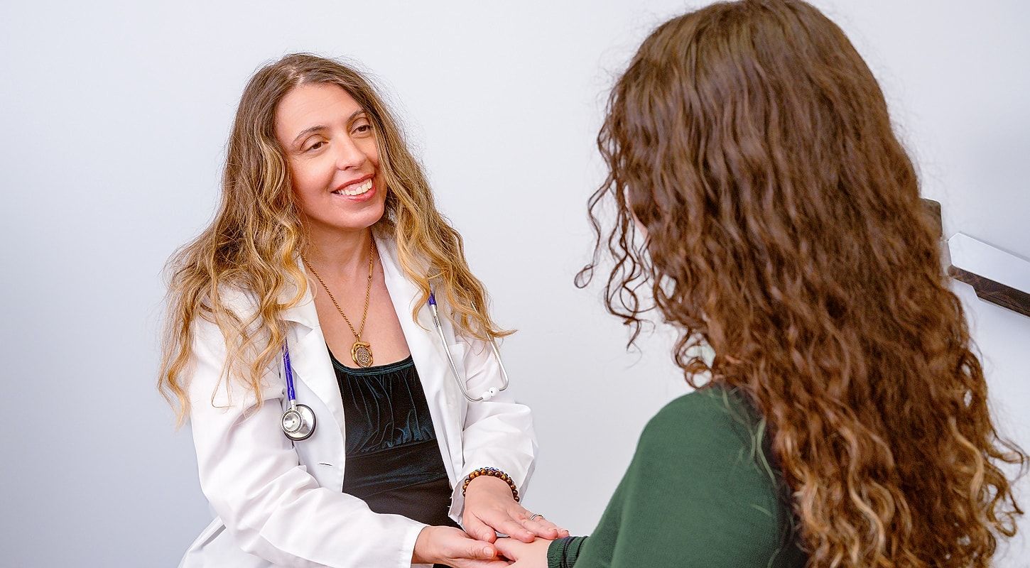 An Avita MD physician listening closely during a primary care visit