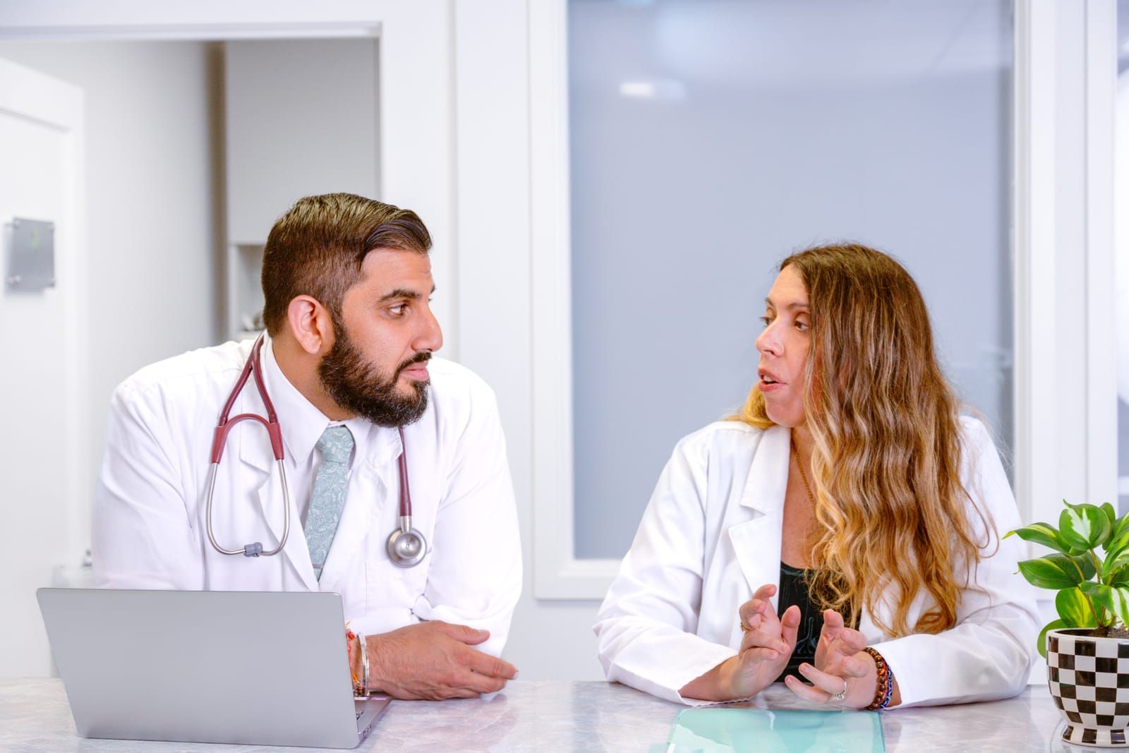 Dr. Sitnitsky and Dr. Taunk reviewing patient care together at Avita MD