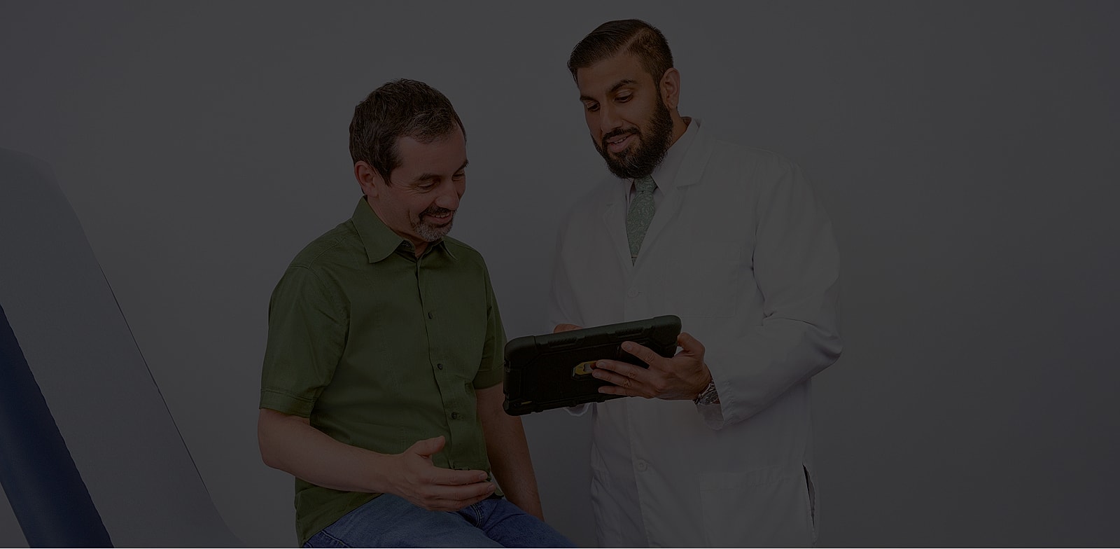 Doctor discussing medical information with patient.